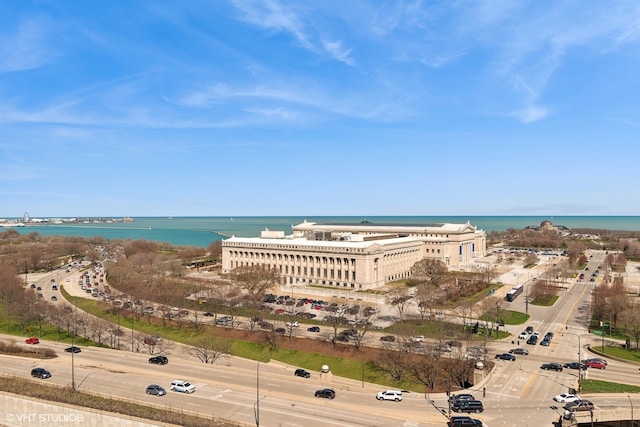 birds eye view of property with a water view