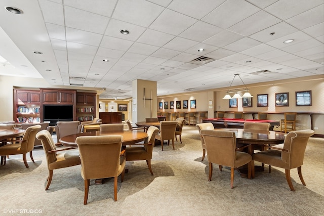 dining room featuring light colored carpet