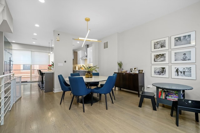 dining room featuring light wood-type flooring