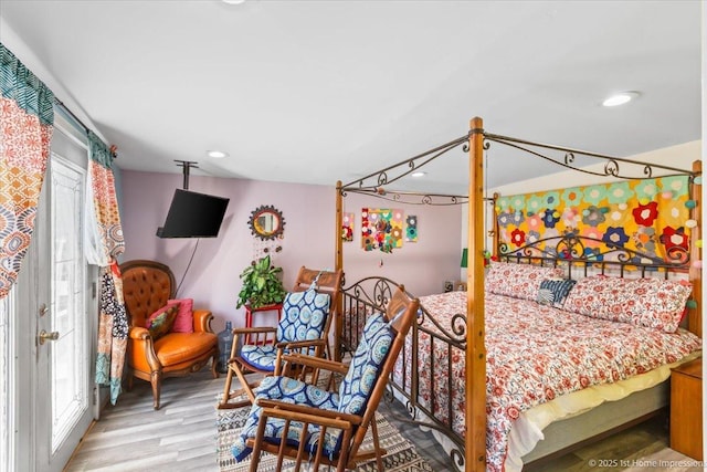 9018 S Brandon Ave, Chicago, IL 60617 - bedroom with multiple windows, light wood-style floors, and recessed lighting