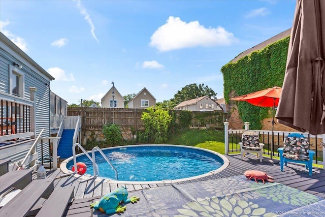 9018 S Brandon Ave, Chicago, IL 60617 - view of swimming pool with a fenced backyard and a deck