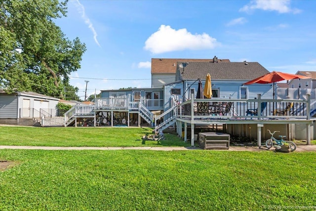 9018 S Brandon Ave, Chicago, IL 60617 - back of house with stairs, a wooden deck, and a lawn