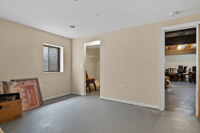 182 Ashley Way, Bloomingdale, IL 60108 - unfurnished bedroom featuring concrete flooring
