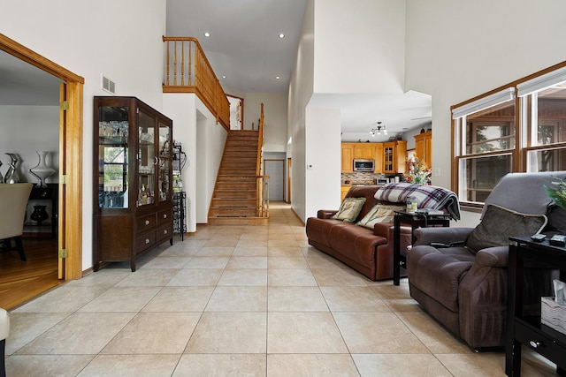 182 Ashley Way, Bloomingdale, IL 60108 - living area featuring a high ceiling, light tile patterned floors, stairs, and recessed lighting
