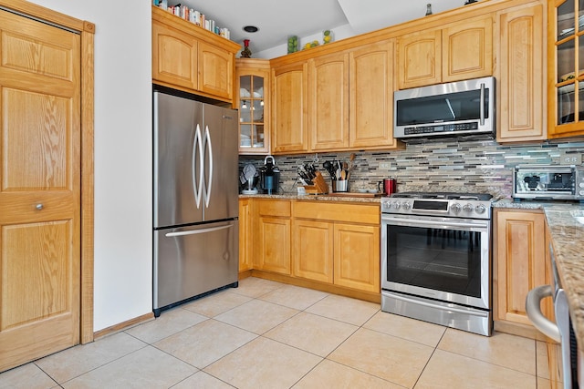 182 Ashley Way, Bloomingdale, IL 60108 - kitchen featuring appliances with stainless steel finishes, tasteful backsplash, and light tile patterned floors