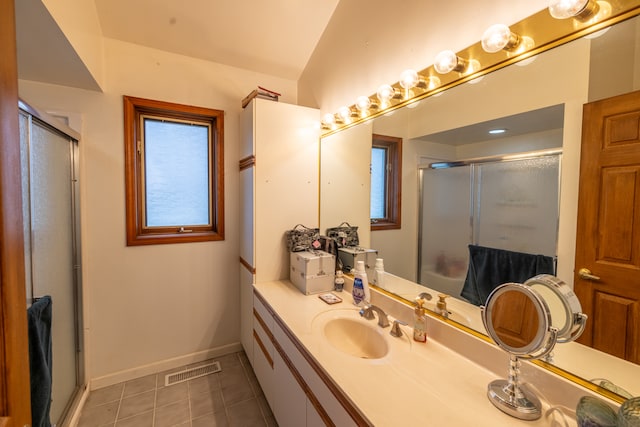 bathroom with lofted ceiling, oversized vanity, and tile flooring