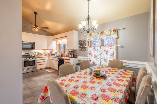 dining area featuring lofted ceiling, sink, light tile floors, and ceiling fan with notable chandelier