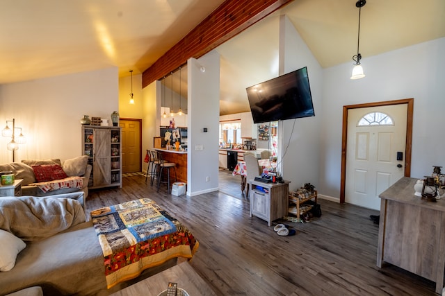 living room with high vaulted ceiling, dark hardwood / wood-style flooring, and beamed ceiling