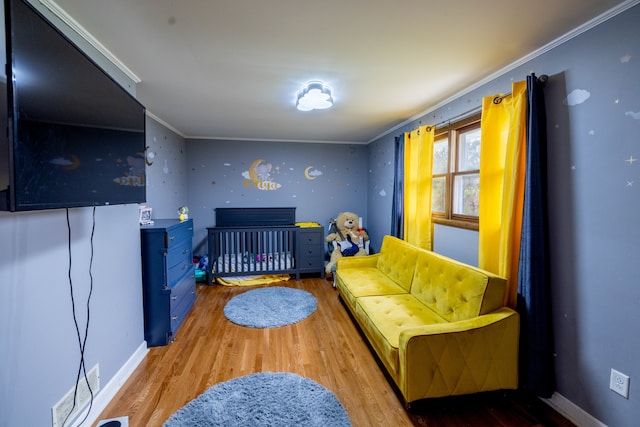 living room featuring crown molding and wood-type flooring