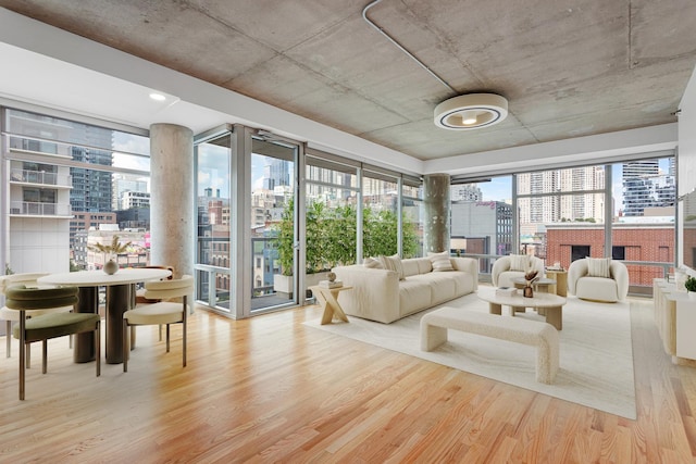 sunroom / solarium with a view of city and a fireplace