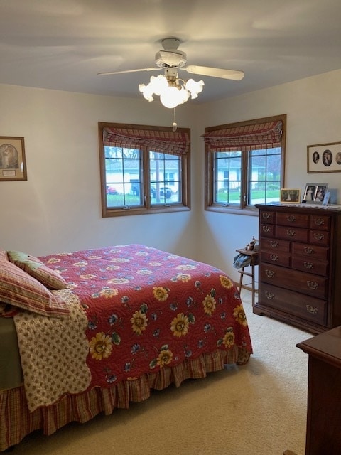 bedroom with carpet flooring and ceiling fan