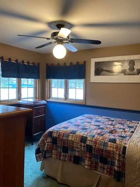 carpeted bedroom with ceiling fan