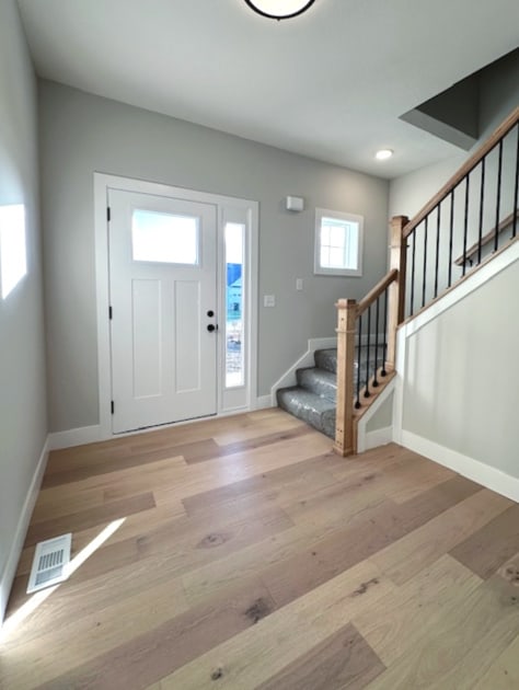 entrance foyer with light wood-type flooring