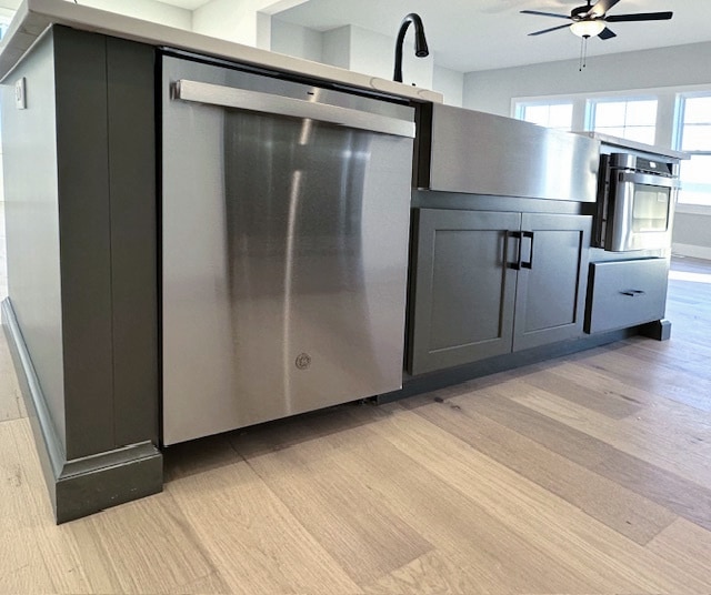 kitchen with ceiling fan and light hardwood / wood-style floors