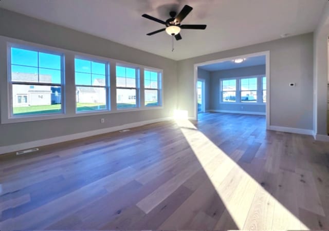 spare room with ceiling fan and dark hardwood / wood-style floors