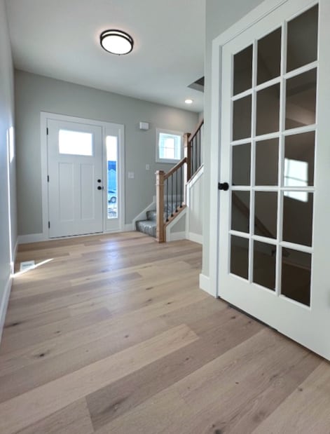 entryway with light hardwood / wood-style flooring