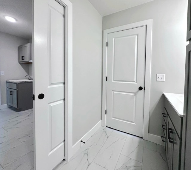 bathroom with tile flooring and vanity