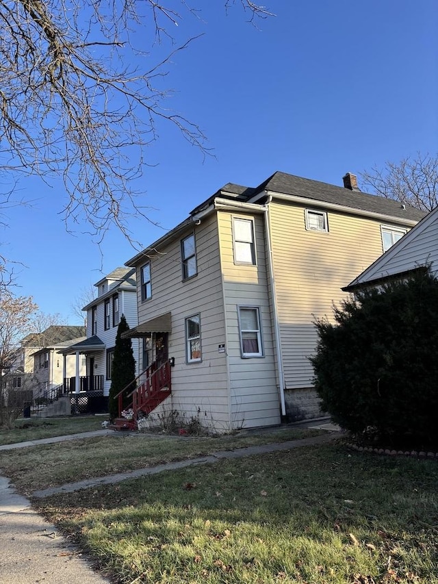 view of home's exterior with a yard