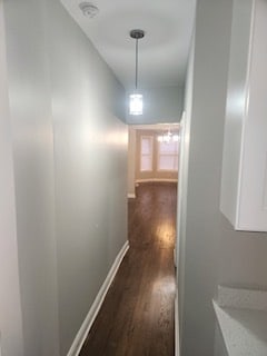 corridor with dark wood-type flooring