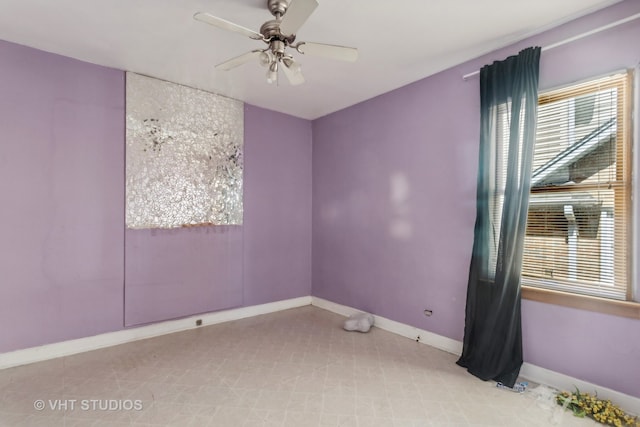 tiled empty room with ceiling fan