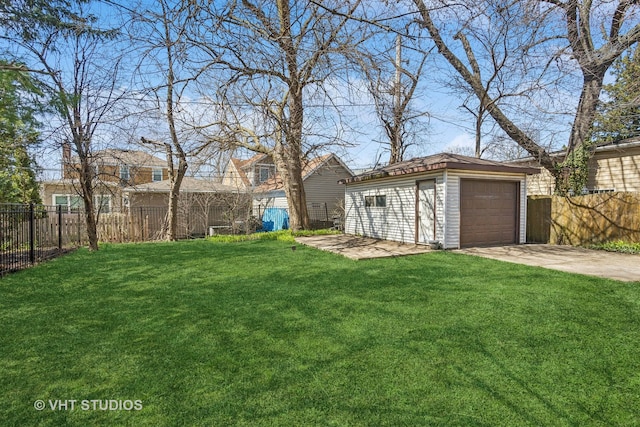 view of yard with a garage and an outdoor structure