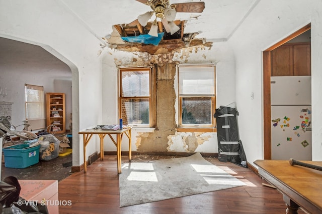 misc room with dark hardwood / wood-style flooring and ceiling fan