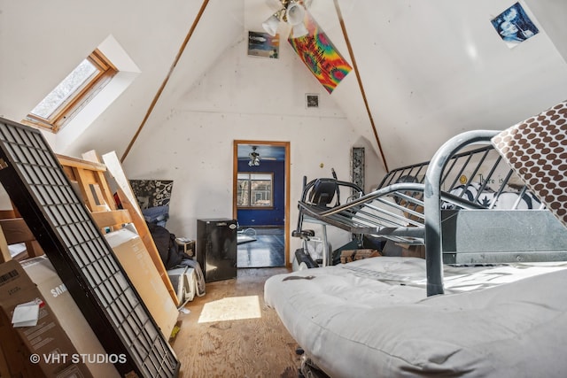 bedroom with a skylight, high vaulted ceiling, multiple windows, and hardwood / wood-style flooring