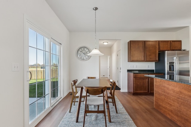 dining area with dark hardwood / wood-style floors