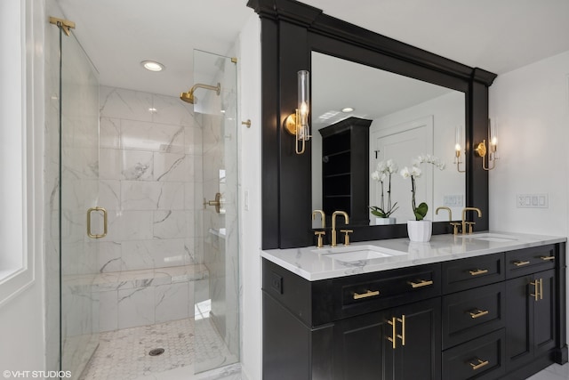 bathroom featuring an enclosed shower and vanity