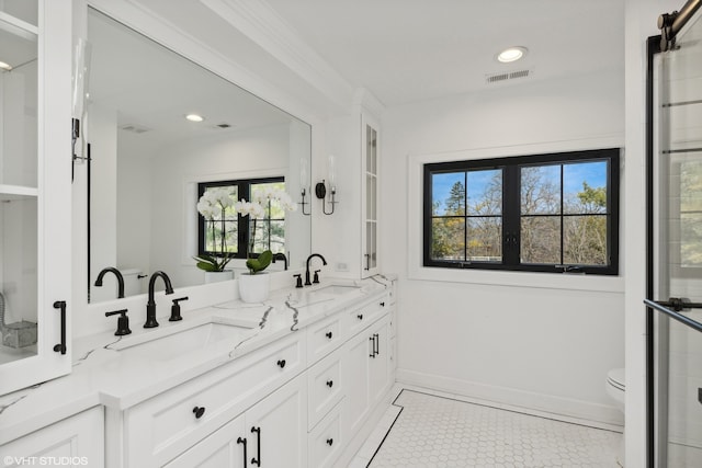 bathroom featuring vanity, toilet, and tile patterned flooring