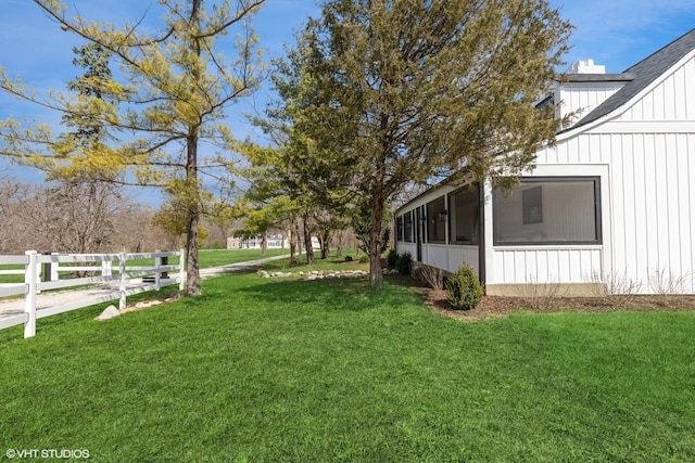 view of yard with a sunroom