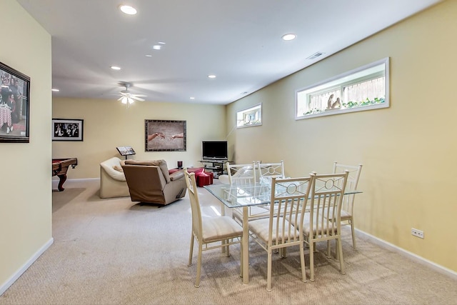 dining area featuring ceiling fan, light carpet, and billiards