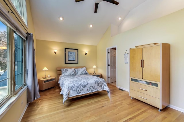 bedroom featuring high vaulted ceiling, ceiling fan, and light hardwood / wood-style flooring