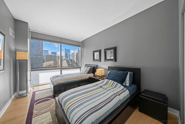 bedroom with light wood-type flooring