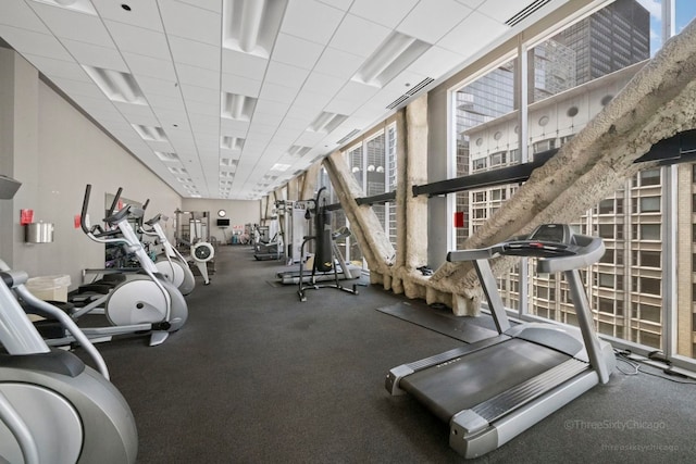 exercise room with a drop ceiling