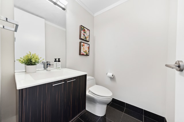 bathroom with tile patterned flooring, vanity, toilet, and ornamental molding