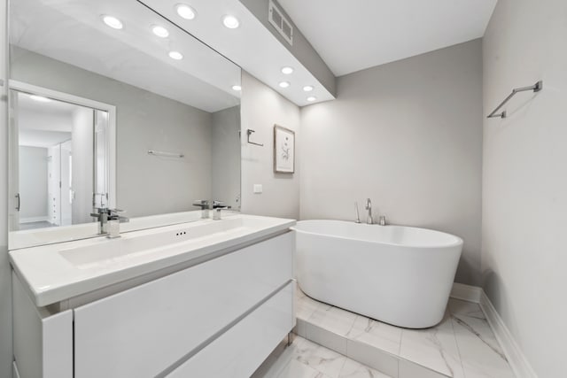 bathroom with vanity and a tub to relax in