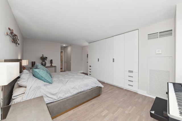 bedroom with light hardwood / wood-style flooring