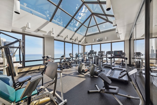 exercise room with a water view