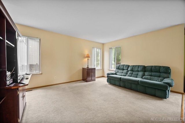 422 Rachel Cir, Romeoville, IL 60446 - carpeted living room featuring baseboards