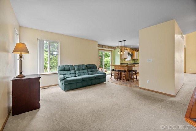 422 Rachel Cir, Romeoville, IL 60446 - living area featuring carpet and healthy amount of natural light