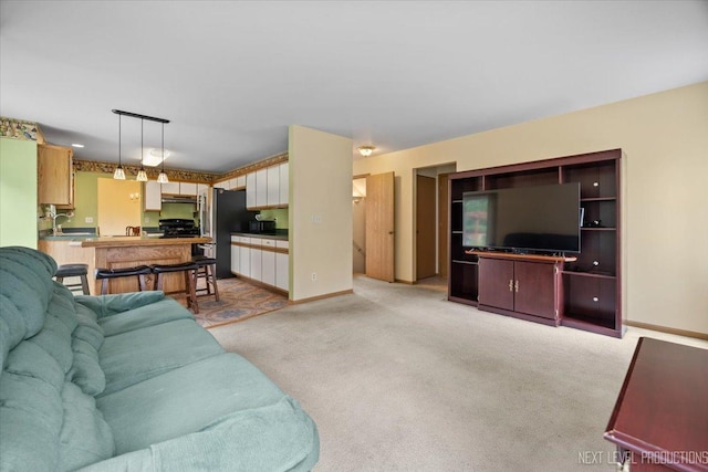 422 Rachel Cir, Romeoville, IL 60446 - living room featuring light colored carpet and baseboards