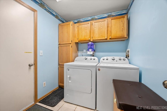 422 Rachel Cir, Romeoville, IL 60446 - laundry room featuring cabinet space, washing machine and clothes dryer, and light tile patterned floors