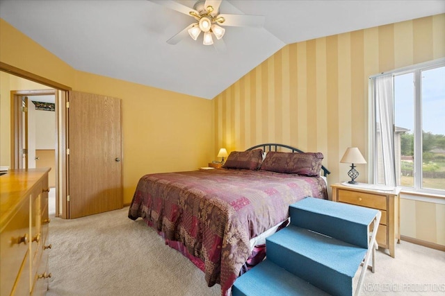 422 Rachel Cir, Romeoville, IL 60446 - bedroom featuring light colored carpet, vaulted ceiling, multiple windows, a ceiling fan, and wallpapered walls