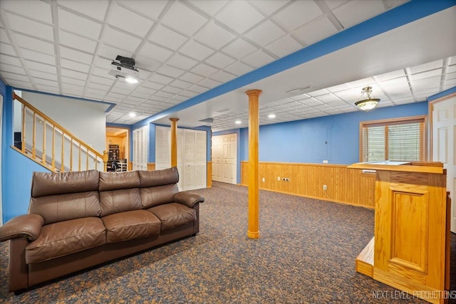 422 Rachel Cir, Romeoville, IL 60446 - living area featuring carpet flooring, a paneled ceiling, a wainscoted wall, and stairs
