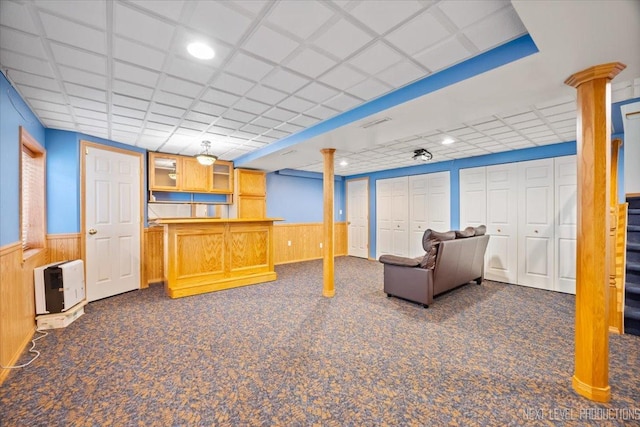 422 Rachel Cir, Romeoville, IL 60446 - carpeted living room with wainscoting, bar, a drop ceiling, wood walls, and recessed lighting