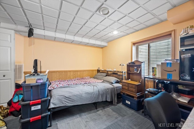 422 Rachel Cir, Romeoville, IL 60446 - bedroom with a wainscoted wall, carpet, and wood walls
