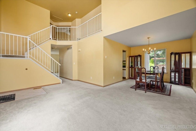 422 Rachel Cir, Romeoville, IL 60446 - dining space with stairway, a chandelier, carpet floors, and a high ceiling