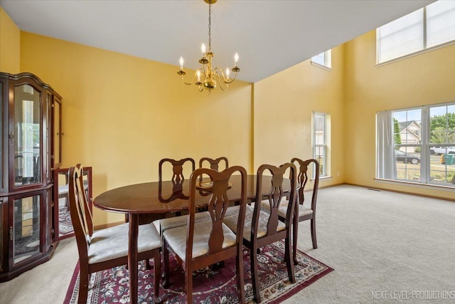 422 Rachel Cir, Romeoville, IL 60446 - carpeted dining area featuring plenty of natural light, a chandelier, and a towering ceiling