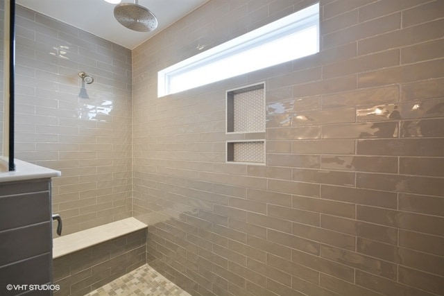 bathroom with tiled shower